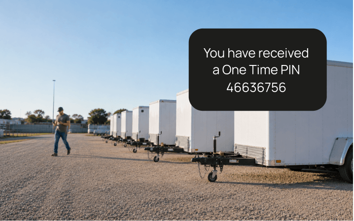 A phone showing the one time PIN message sent to a customer for their trailer booking