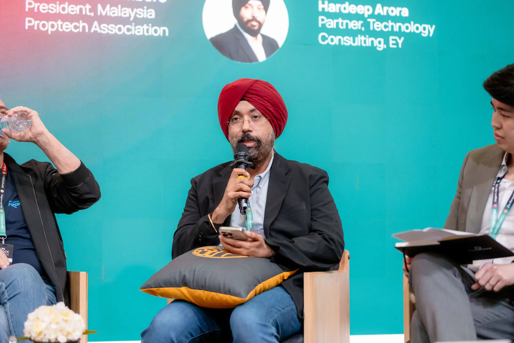 EY technology consulting partner Hardeep Arora speaking on a panel at UNLOCKED26