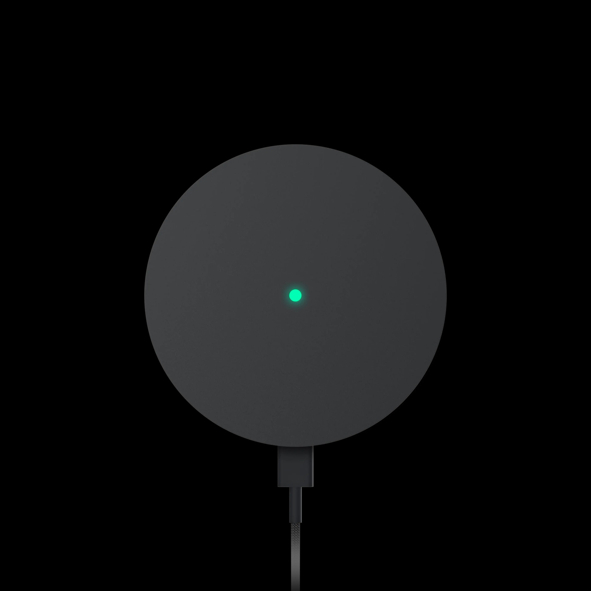 The igloo Bridge 2 face-on, a round matte black hub with a green status light, its braided USB-C power cable trailing down