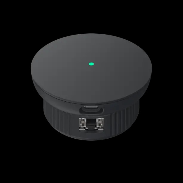 The igloo Bridge 2 seated on the ridged AE1 Network Adapter, with the adapter's Ethernet port on its side
