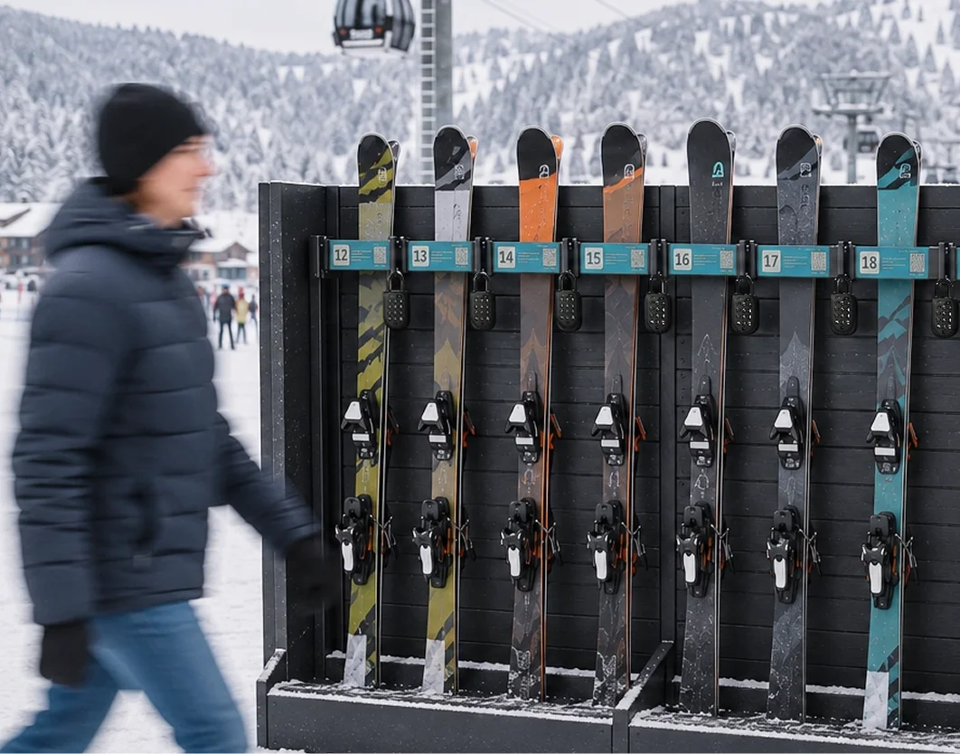 Skis collected from a self-serve rental rack secured with a smart lock