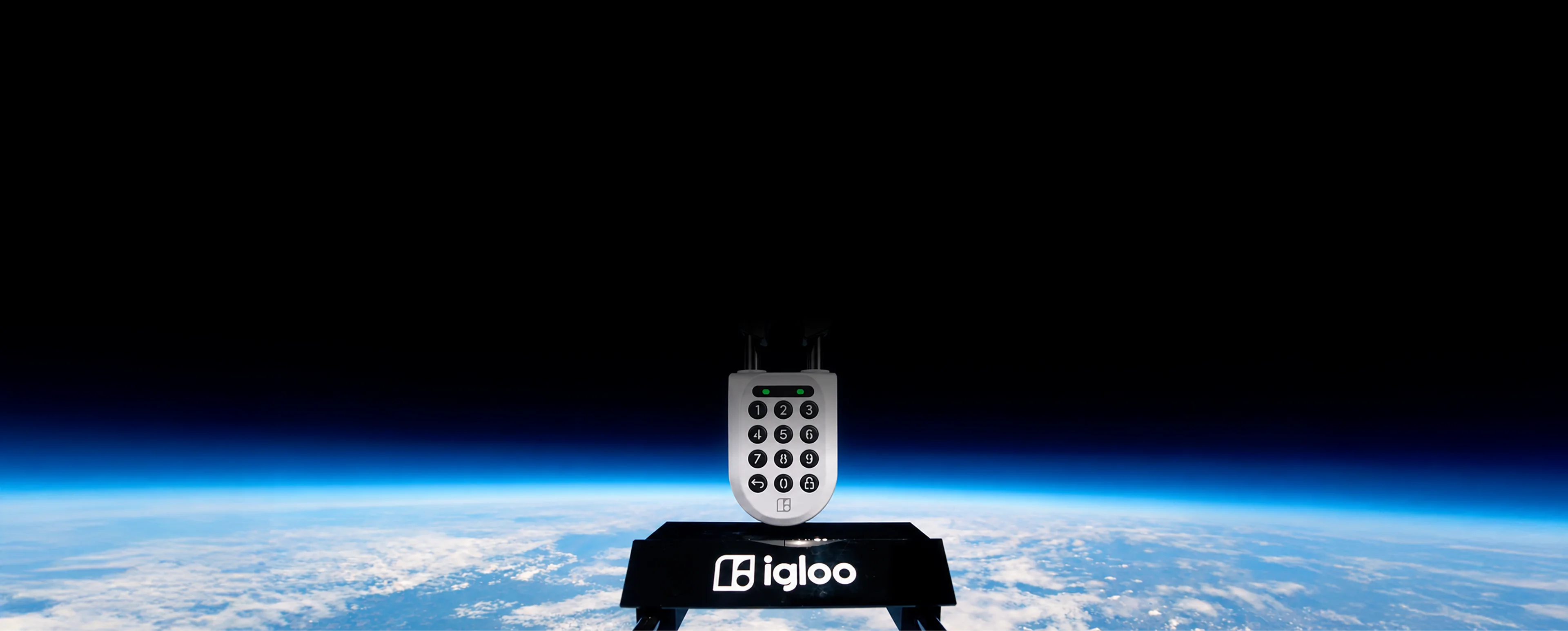 An igloo Padlock 2 on an igloo-branded stand at the edge of space, above the blue curve of the Earth