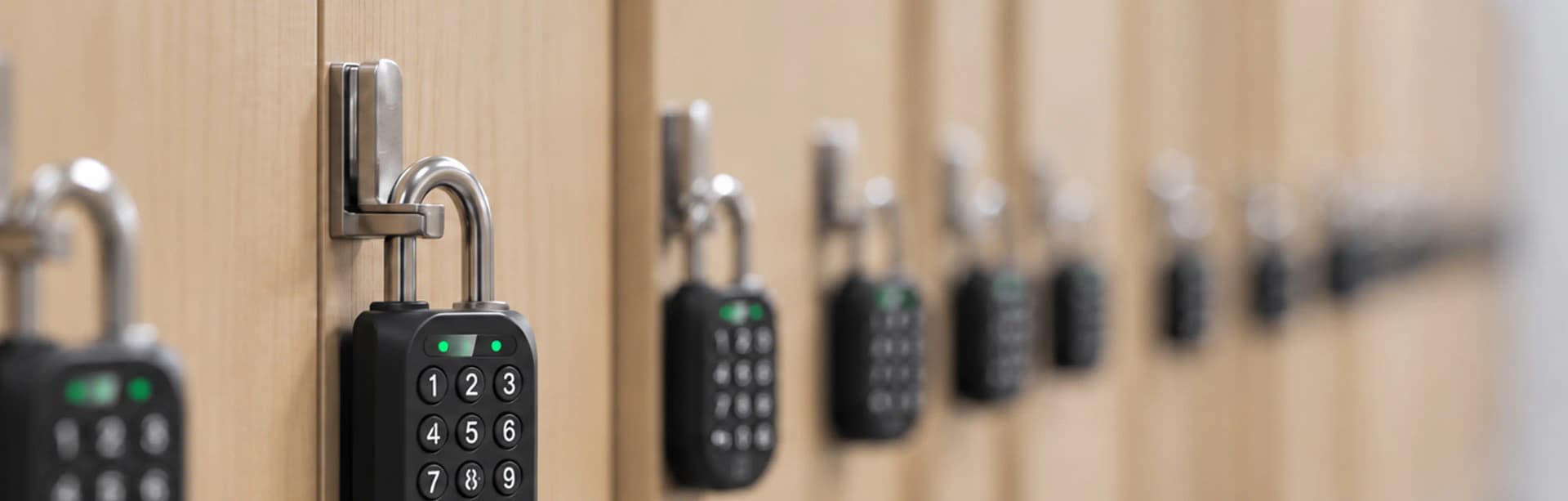 An igloo Padlock 2 smart lock securing the hasp of a wooden locker door