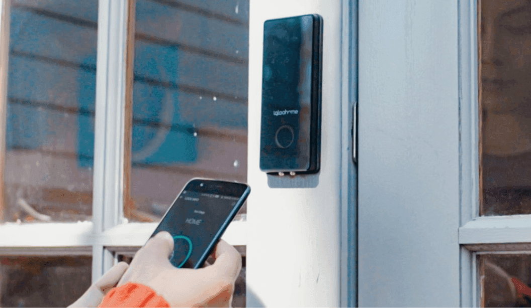 A prospect unlocking a rental home deadbolt with the igloohome mobile app