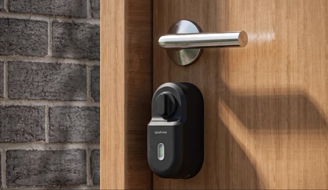 An igloo Retrofit Lock installed on the existing wooden door of a rental property